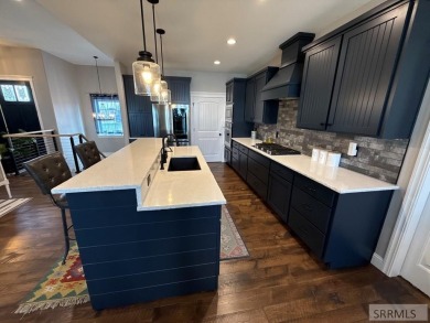 Spiral piers are the focal point of the double door grand entry on Teton Lakes Golf Courses in Idaho - for sale on GolfHomes.com, golf home, golf lot