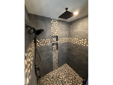 Spiral piers are the focal point of the double door grand entry on Teton Lakes Golf Courses in Idaho - for sale on GolfHomes.com, golf home, golf lot