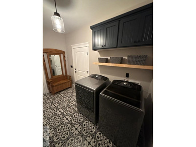 Spiral piers are the focal point of the double door grand entry on Teton Lakes Golf Courses in  - for sale on GolfHomes.com, golf home, golf lot