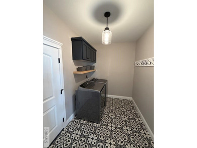 Spiral piers are the focal point of the double door grand entry on Teton Lakes Golf Courses in  - for sale on GolfHomes.com, golf home, golf lot