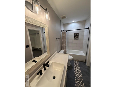 Spiral piers are the focal point of the double door grand entry on Teton Lakes Golf Courses in  - for sale on GolfHomes.com, golf home, golf lot