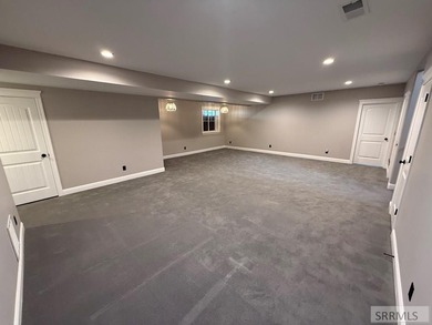 Spiral piers are the focal point of the double door grand entry on Teton Lakes Golf Courses in  - for sale on GolfHomes.com, golf home, golf lot