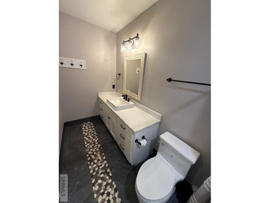 Spiral piers are the focal point of the double door grand entry on Teton Lakes Golf Courses in  - for sale on GolfHomes.com, golf home, golf lot