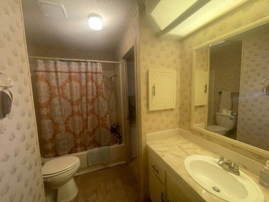 4530 9th St. #48 Bradenton, FL 34203  Twin Oaks 55+ Mobile Home on Heather Hills Golf Course in Florida - for sale on GolfHomes.com, golf home, golf lot