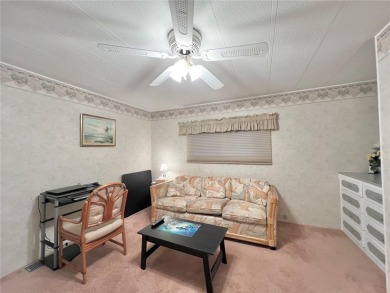 Welcome to this meticulously maintained double-wide home on Fairway Village Golf Course in Florida - for sale on GolfHomes.com, golf home, golf lot