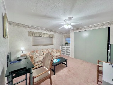 Welcome to this meticulously maintained double-wide home on Fairway Village Golf Course in Florida - for sale on GolfHomes.com, golf home, golf lot