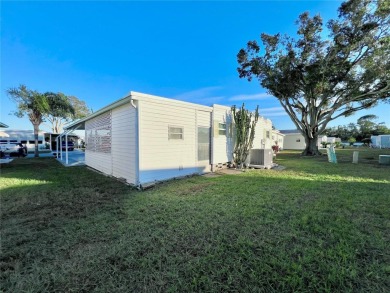 Welcome to this meticulously maintained double-wide home on Fairway Village Golf Course in Florida - for sale on GolfHomes.com, golf home, golf lot