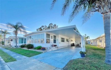 Welcome to this meticulously maintained double-wide home on Fairway Village Golf Course in Florida - for sale on GolfHomes.com, golf home, golf lot