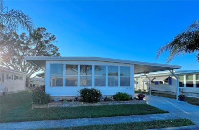 Welcome to this meticulously maintained double-wide home on Fairway Village Golf Course in Florida - for sale on GolfHomes.com, golf home, golf lot