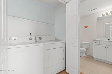 Experience easy coastal living in this fully furnished 2-bedroom on South Harbour Golf Links in North Carolina - for sale on GolfHomes.com, golf home, golf lot