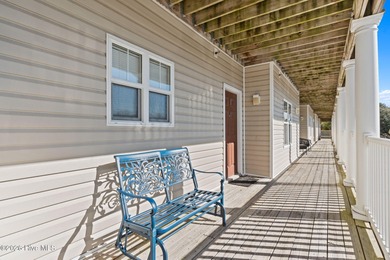 Experience easy coastal living in this fully furnished 2-bedroom on South Harbour Golf Links in North Carolina - for sale on GolfHomes.com, golf home, golf lot