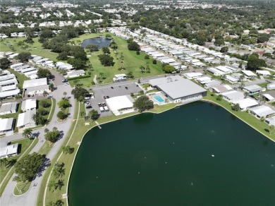 Welcome to this meticulously maintained double-wide home on Fairway Village Golf Course in Florida - for sale on GolfHomes.com, golf home, golf lot