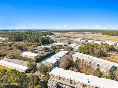 Experience easy coastal living in this fully furnished 2-bedroom on South Harbour Golf Links in North Carolina - for sale on GolfHomes.com, golf home, golf lot