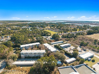 Experience easy coastal living in this fully furnished 2-bedroom on South Harbour Golf Links in North Carolina - for sale on GolfHomes.com, golf home, golf lot