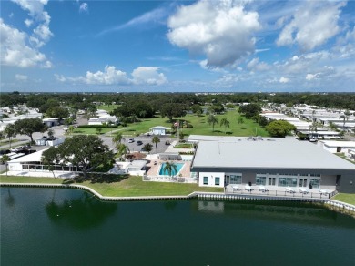 Welcome to this meticulously maintained double-wide home on Fairway Village Golf Course in Florida - for sale on GolfHomes.com, golf home, golf lot