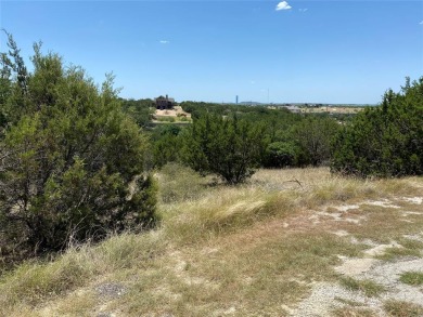 This wooded lot has the potential for a view of Possum Kingdom on The Cliffs Resort in Texas - for sale on GolfHomes.com, golf home, golf lot