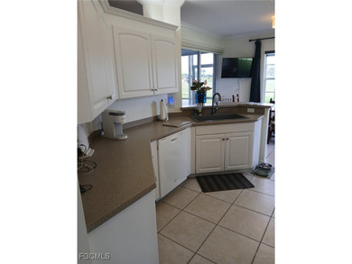 This charming condo located at 5877 Three Iron Drive in Naples on The Club At Strand in Florida - for sale on GolfHomes.com, golf home, golf lot