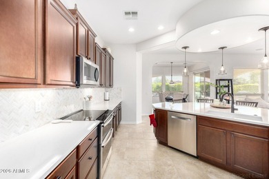 This beautifully maintained home features bright tile flooring on Trilogy Golf Club At Vistancia in Arizona - for sale on GolfHomes.com, golf home, golf lot