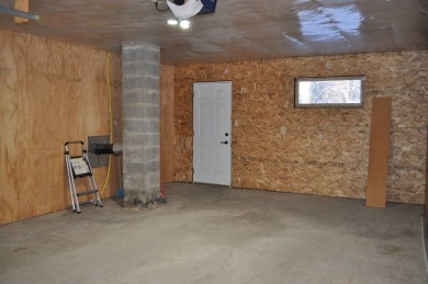 A well-kept split level home with 2 bedrooms on the main floor on Cooperstown Country Club in North Dakota - for sale on GolfHomes.com, golf home, golf lot