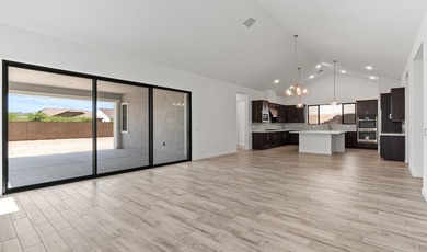 Expansive great room and dining area with optional vaulted on  in Arizona - for sale on GolfHomes.com, golf home, golf lot