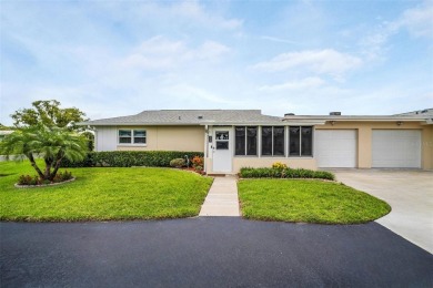 Beautifully updated villa-style condo in Palm Harbor's premier on Highland Lakes Executive Golf Course in Florida - for sale on GolfHomes.com, golf home, golf lot