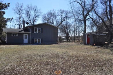 A well-kept split level home with 2 bedrooms on the main floor on Cooperstown Country Club in North Dakota - for sale on GolfHomes.com, golf home, golf lot
