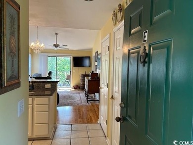 This corner unit golf course condo is tucked away in a serene on True Blue Plantation in South Carolina - for sale on GolfHomes.com, golf home, golf lot