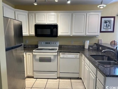 This corner unit golf course condo is tucked away in a serene on True Blue Plantation in South Carolina - for sale on GolfHomes.com, golf home, golf lot