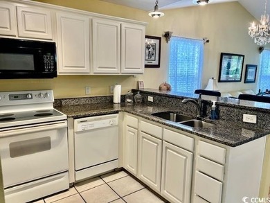 This corner unit golf course condo is tucked away in a serene on True Blue Plantation in South Carolina - for sale on GolfHomes.com, golf home, golf lot