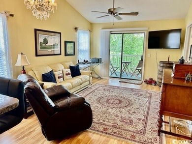 This corner unit golf course condo is tucked away in a serene on True Blue Plantation in South Carolina - for sale on GolfHomes.com, golf home, golf lot