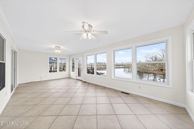 Wake up to shimmering water views and spend your evenings on Lake Tansi Village Country Club in Tennessee - for sale on GolfHomes.com, golf home, golf lot