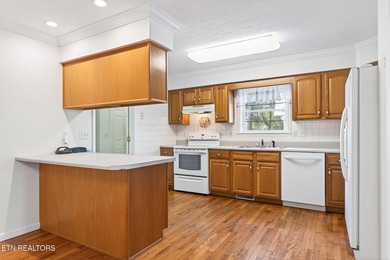 Wake up to shimmering water views and spend your evenings on Lake Tansi Village Country Club in Tennessee - for sale on GolfHomes.com, golf home, golf lot