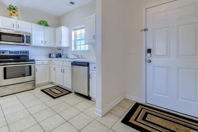 Enjoy easy coastal living in this 2-bedroom, 2-bath condo on Barefoot Resort and Golf Club  in South Carolina - for sale on GolfHomes.com, golf home, golf lot