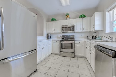 Enjoy easy coastal living in this 2-bedroom, 2-bath condo on Barefoot Resort and Golf Club  in South Carolina - for sale on GolfHomes.com, golf home, golf lot