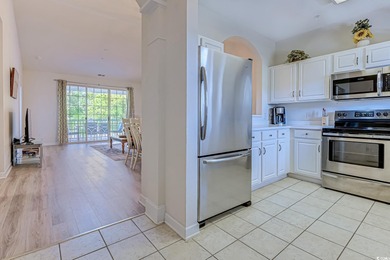 Enjoy easy coastal living in this 2-bedroom, 2-bath condo on Barefoot Resort and Golf Club  in South Carolina - for sale on GolfHomes.com, golf home, golf lot