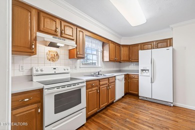 Wake up to shimmering water views and spend your evenings on Lake Tansi Village Country Club in Tennessee - for sale on GolfHomes.com, golf home, golf lot