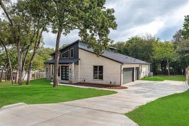 Modern design and timeless craftsmanship combine in this 2,344 on Pecan Plantation Country Club in Texas - for sale on GolfHomes.com, golf home, golf lot