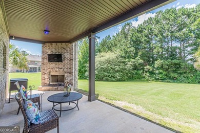 Discover this beautifully designed 4-sided brick home tucked on Crystal Lake Golf and Country Club in Georgia - for sale on GolfHomes.com, golf home, golf lot