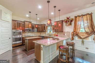 Discover this beautifully designed 4-sided brick home tucked on Crystal Lake Golf and Country Club in Georgia - for sale on GolfHomes.com, golf home, golf lot