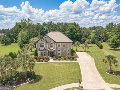 Discover this beautifully designed 4-sided brick home tucked on Crystal Lake Golf and Country Club in Georgia - for sale on GolfHomes.com, golf home, golf lot