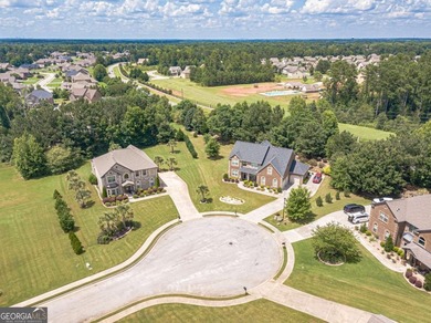 Discover this beautifully designed 4-sided brick home tucked on Crystal Lake Golf and Country Club in Georgia - for sale on GolfHomes.com, golf home, golf lot