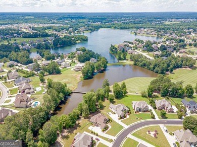 Discover this beautifully designed 4-sided brick home tucked on Crystal Lake Golf and Country Club in Georgia - for sale on GolfHomes.com, golf home, golf lot