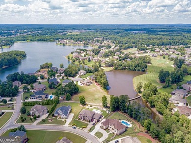 Discover this beautifully designed 4-sided brick home tucked on Crystal Lake Golf and Country Club in Georgia - for sale on GolfHomes.com, golf home, golf lot