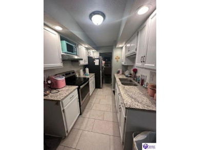 Enjoy resort-style living with beautiful views of the Doe Valley on Doe Valley Country Club in Kentucky - for sale on GolfHomes.com, golf home, golf lot