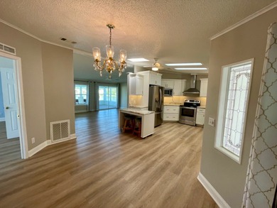 This Water View/Golf Course View Home has been renovated by the on Water Oak Country Club Estates in Florida - for sale on GolfHomes.com, golf home, golf lot