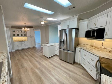 This Water View/Golf Course View Home has been renovated by the on Water Oak Country Club Estates in Florida - for sale on GolfHomes.com, golf home, golf lot