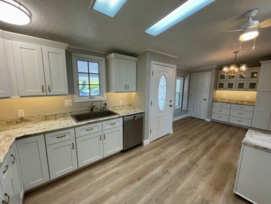 This Water View/Golf Course View Home has been renovated by the on Water Oak Country Club Estates in Florida - for sale on GolfHomes.com, golf home, golf lot