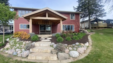 Welcome home to this beautiful, updated, unique charming rustic on Lakes of the Four Seasons Country Club in Indiana - for sale on GolfHomes.com, golf home, golf lot