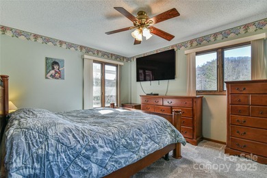 A Sunlit Corner Retreat in The Lynx - Wrapped in Woods, Light on Black Mountain Golf Course in North Carolina - for sale on GolfHomes.com, golf home, golf lot