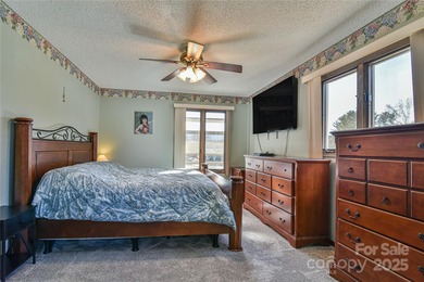 A Sunlit Corner Retreat in The Lynx - Wrapped in Woods, Light on Black Mountain Golf Course in North Carolina - for sale on GolfHomes.com, golf home, golf lot